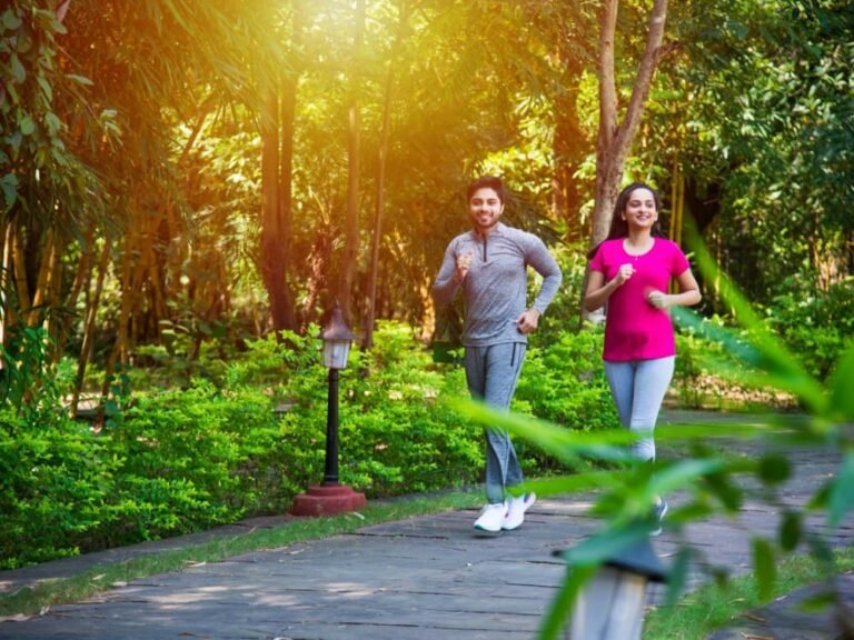 indian-asian-young-couple-jogging-running-exercising-stretching-outdoors-park-nature