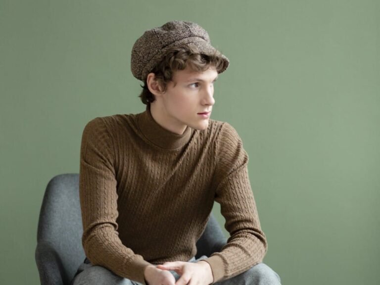 portrait-young-man-with-hat-sitting-chair